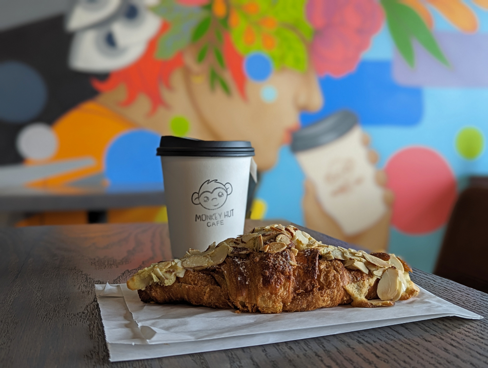coffee and almond croissant at Monkey Hut Cafe in Markham