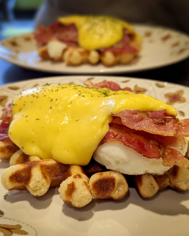 Waffle Eggs Benedict at Munchies Cafe in Hamilton