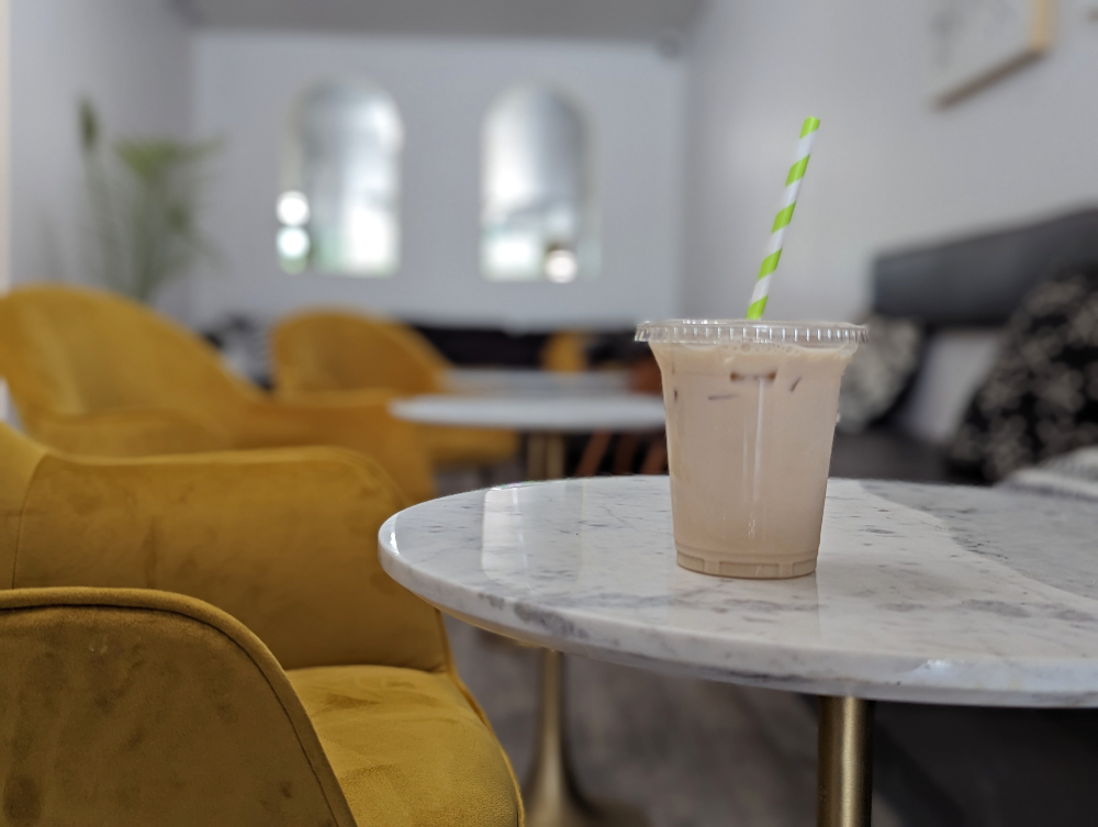 Ice Latte sitting on a table at Books & Beans coffee shop in Sudbury