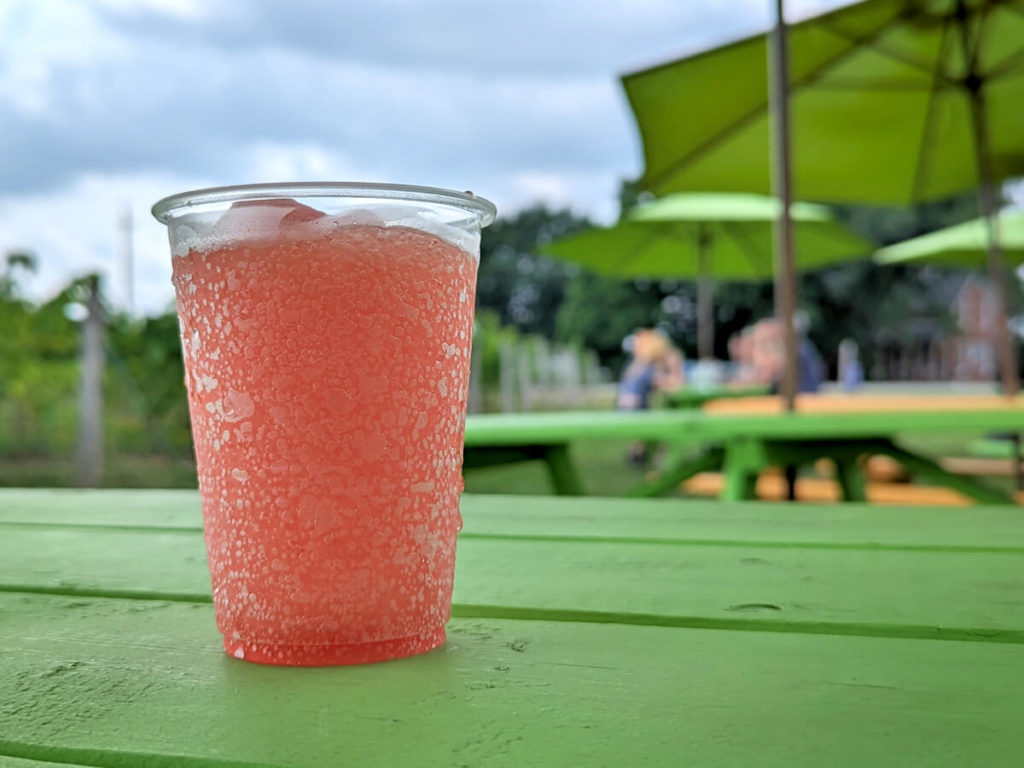 Pink Frozen Beverage on a Green Patio Table